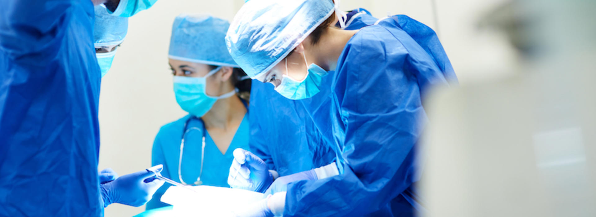 Surgeons operating on a patient