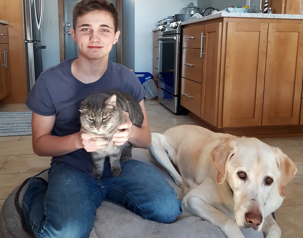 Cody Waterhouse with his cat, Cinder and dog, Bear