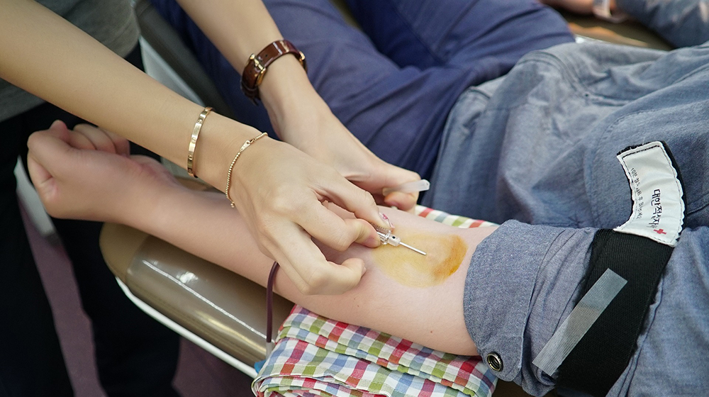 A close-up of an arm while they give plasma