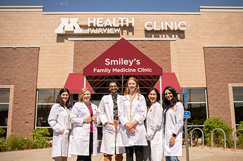 Residents in front of Smiley's Clinic