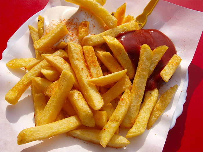 A serving of french fries and ketchup.