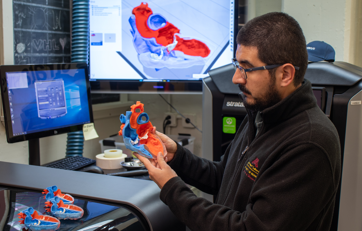 Javier Navarro Rueda holding 3D heart model