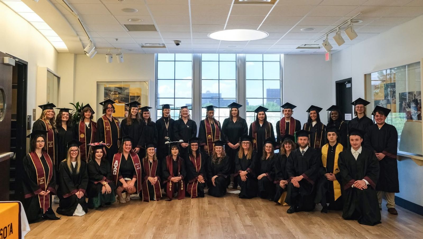 Graduates lined up together for a class photo