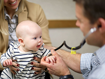 A baby being examined by a doctor - Willmar rural primary care
