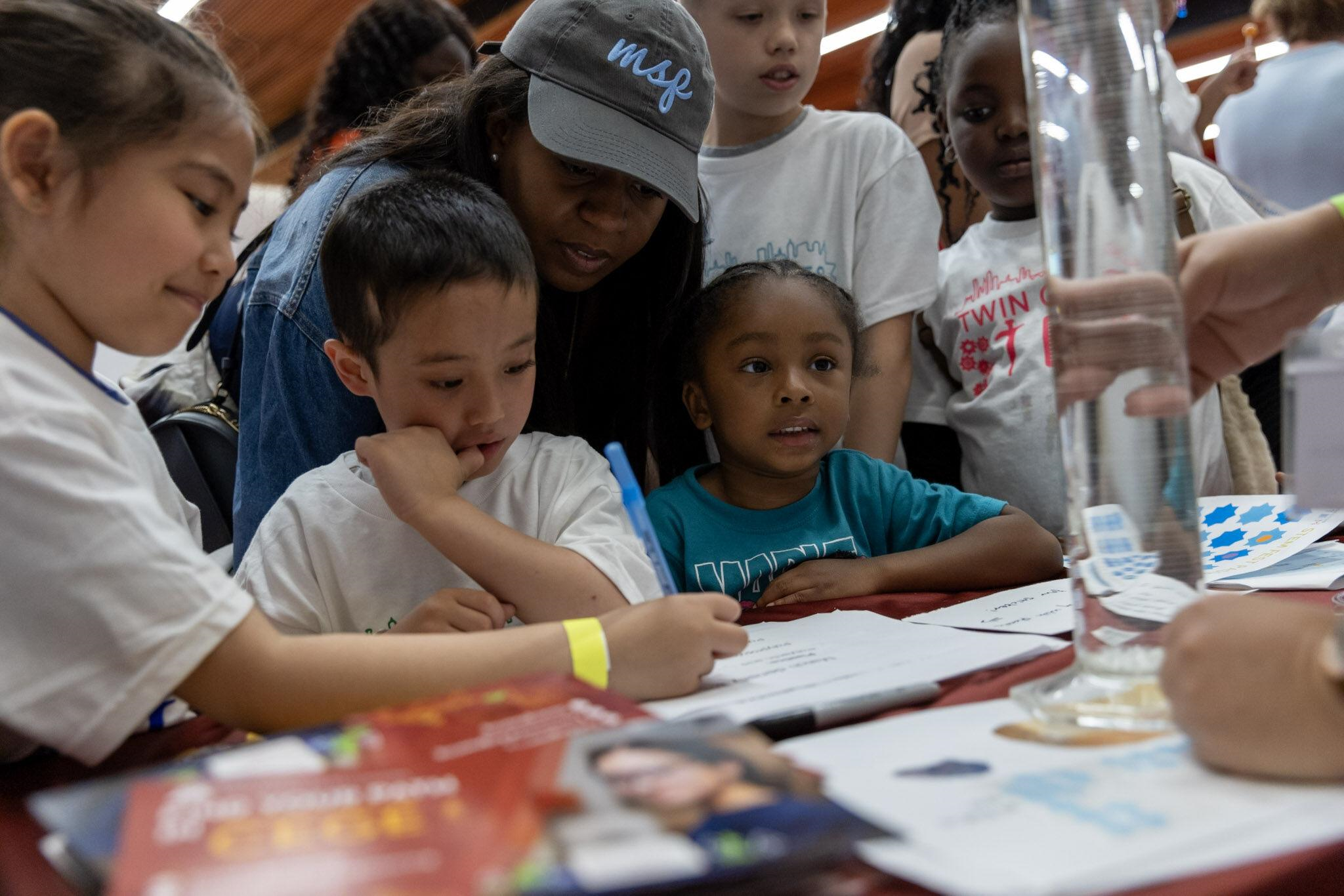 Kids engaging at an activity lab at STEMFEST 2024