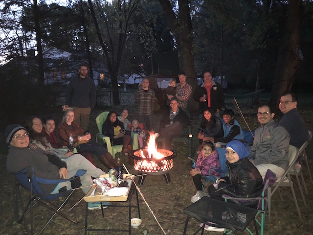 PMR residents and attending at a bonfire. 