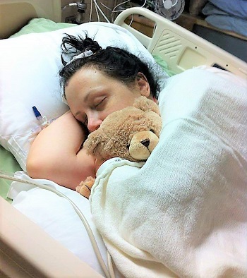 Laura Walz sleeping with teddy bear