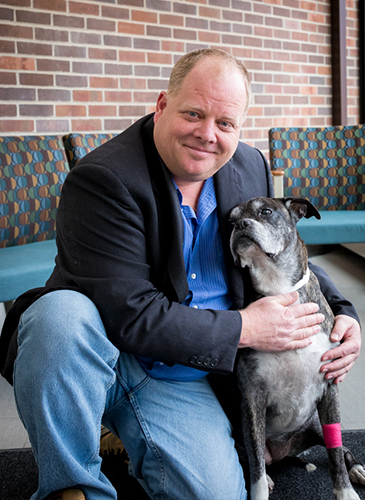 Michael Olin, Ph.D., with a dog