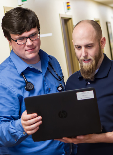 First-year  resident John Tronnes, M.D., consults with third-year  resident Steve Solum, M.D.,  at the CentraCare Family Health Center in St. Cloud