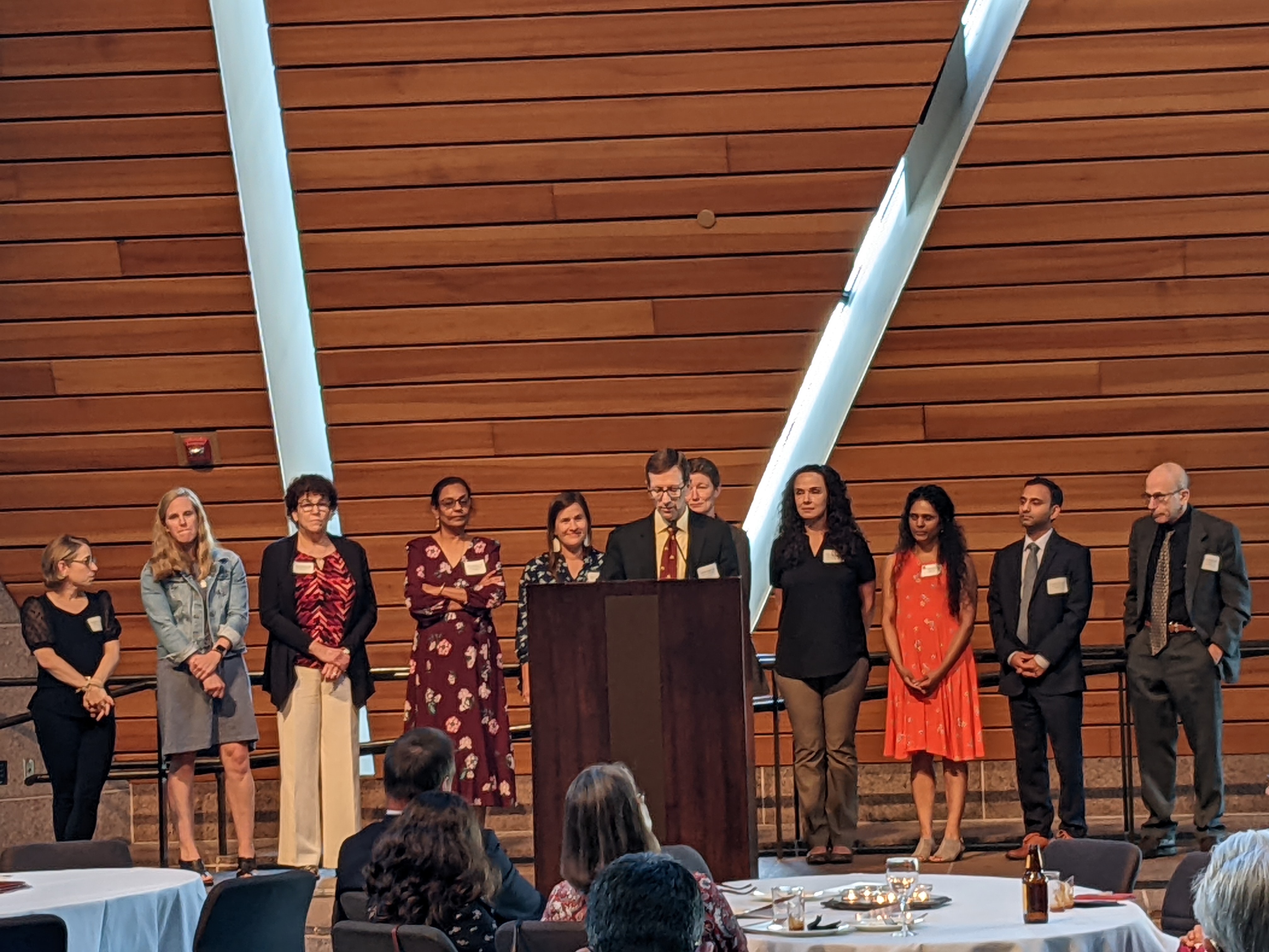 Department Head Dr. Joseph Neglia presenting promoted faculty at the Medical School Promotion & Tenure Reception on June 22, 2022.