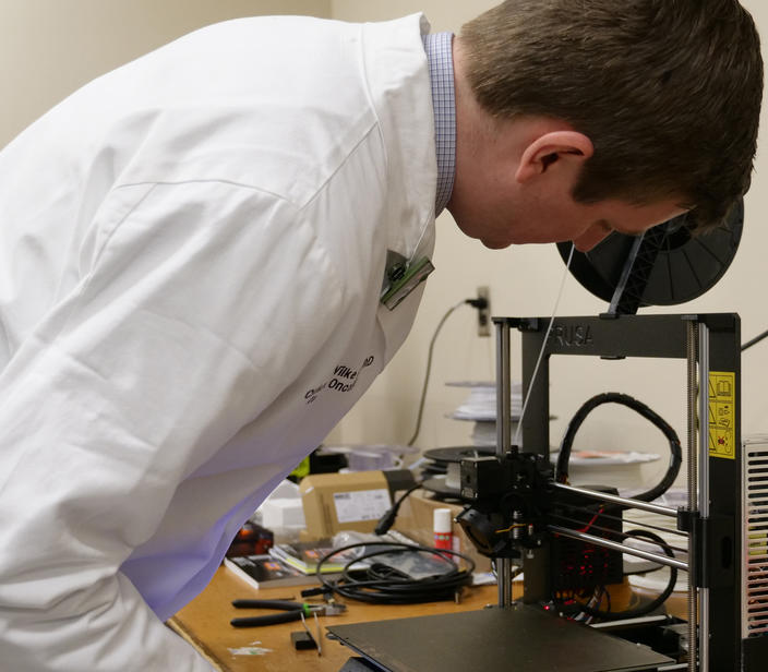Dr. Wilke prepping a 3D printer