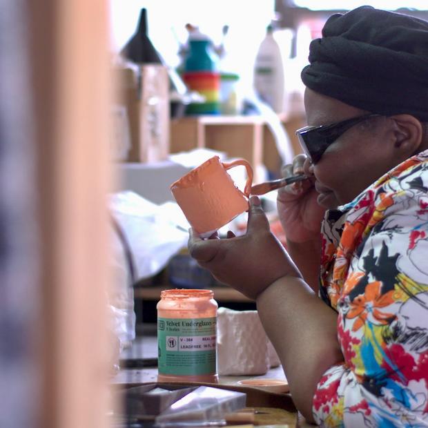 Artist Donna Ray creates pottery on set of Art + Medicine: Disability, Culture and Creativity