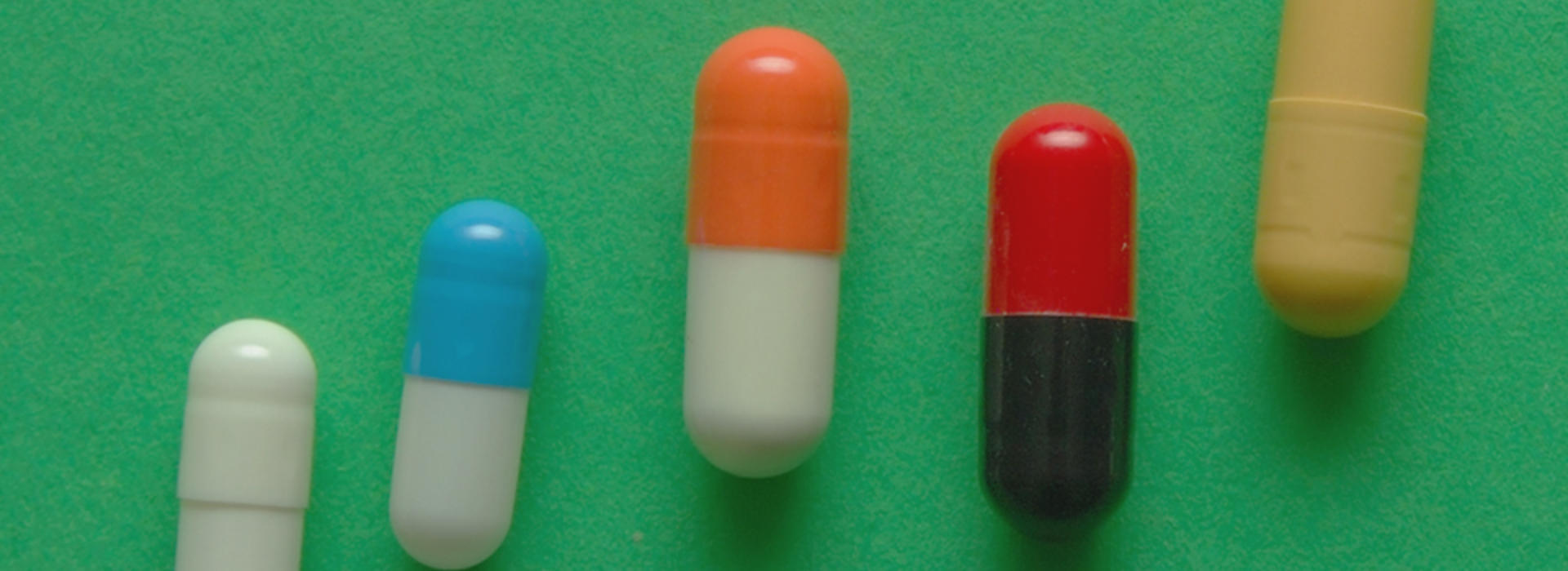 A row of pills trending upward in a line.