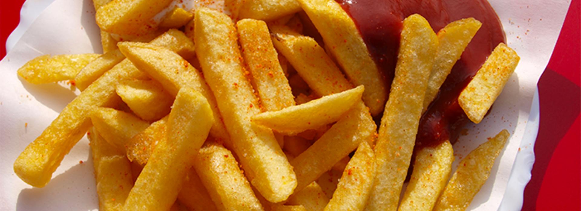 A serving of french fries and ketchup.