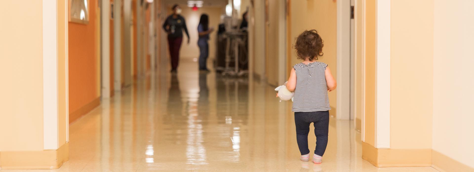 Baby walking through the hallways