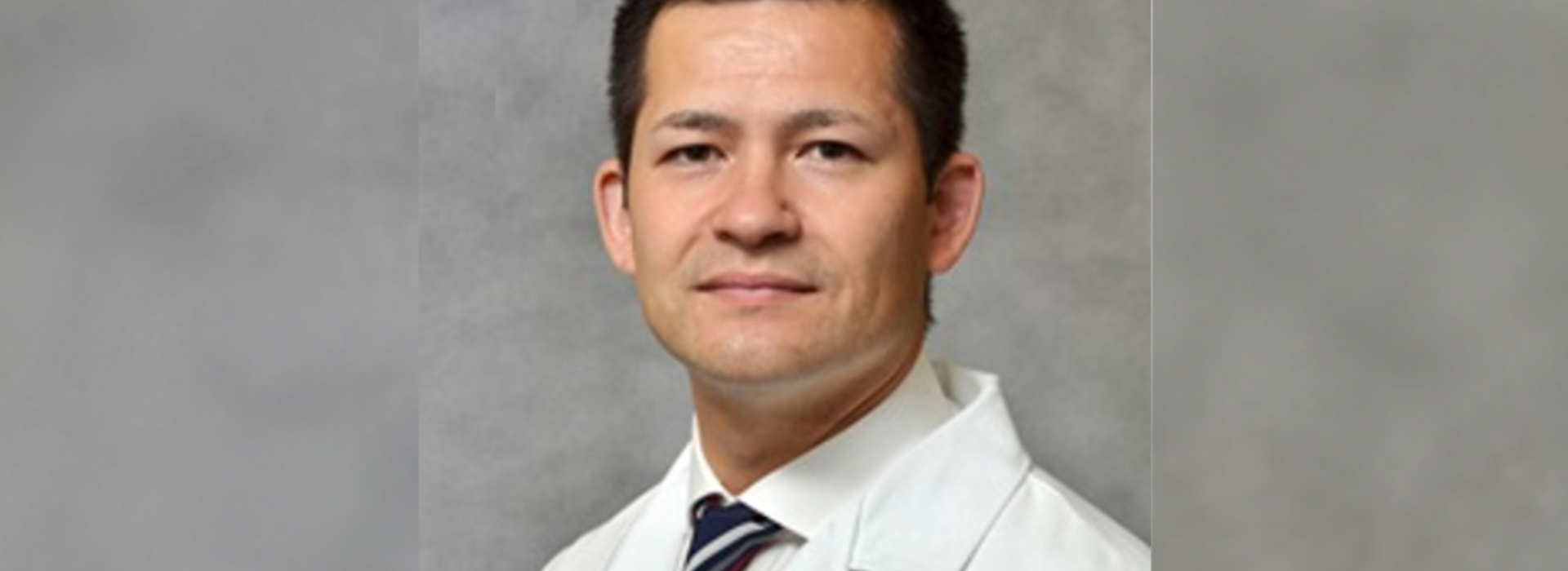 Dr. Nicholas Lim poses for professional headshot