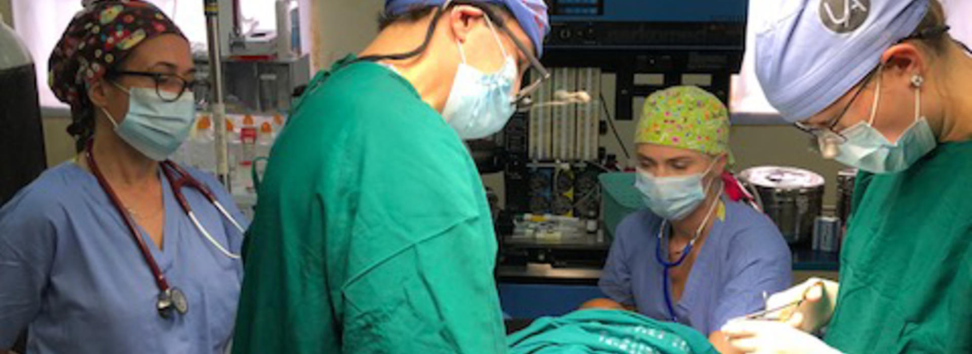 Surgeons and anesthesiologists performing surgery in Uganda