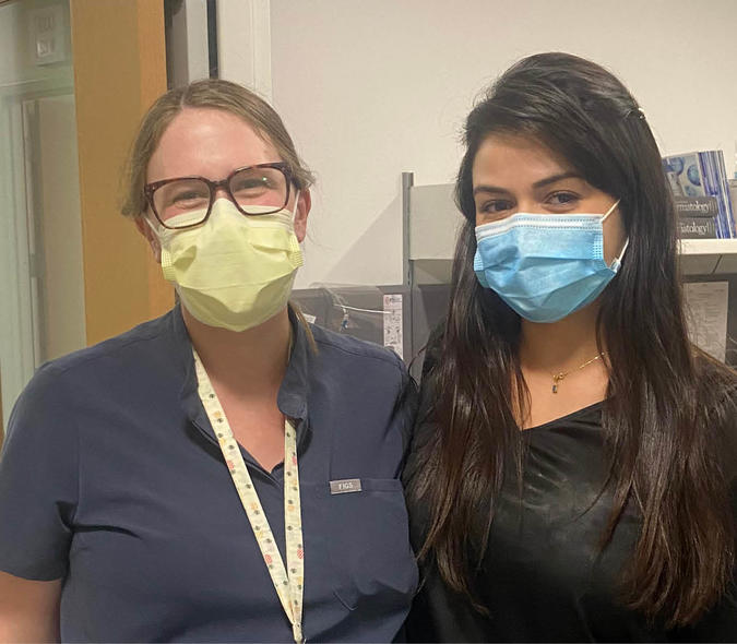 Physician Brittney Schultz and medical student Camila Jaramillo standing for a photo. 