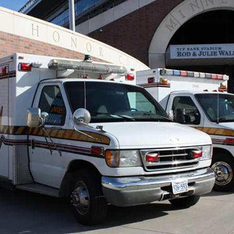University of Minnesota ambulances parked on campus.