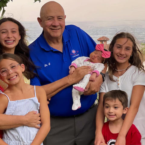 Dr. Gutierrez and his wife, Martha, with their grandchildren