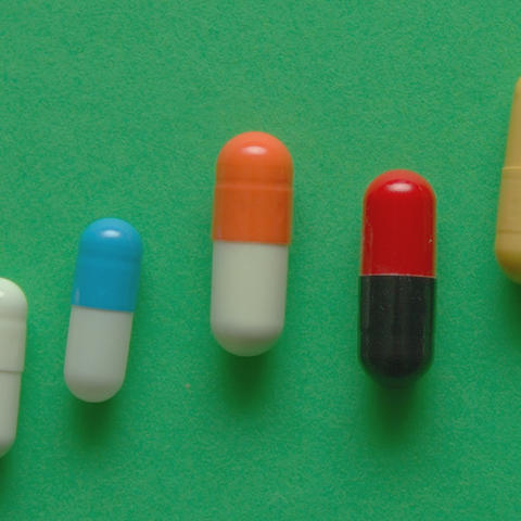 A row of pills trending upward in a line.