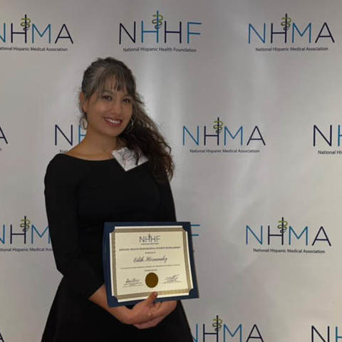 Edith Hernandez with her award