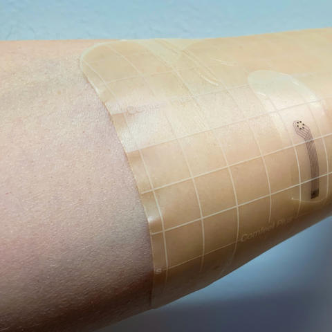 An arm with a bandage on it.