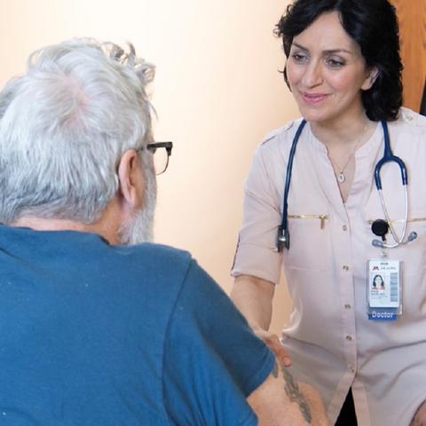 Parisa Salehi, MD, with a patient