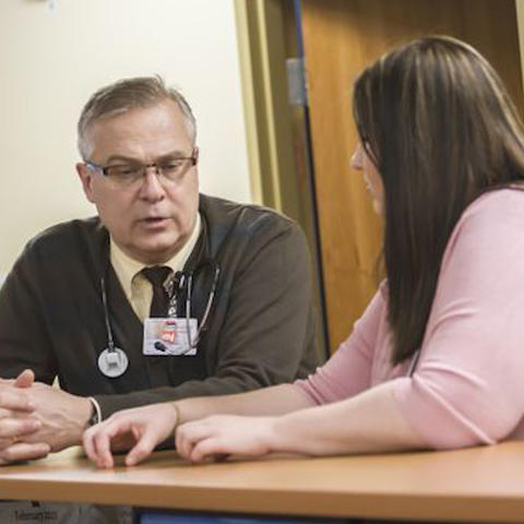 Faculty physician Denny Peterson consults with resident physician Leesa Larson in February at the CentraCare Family Health Center in St. Cloud.