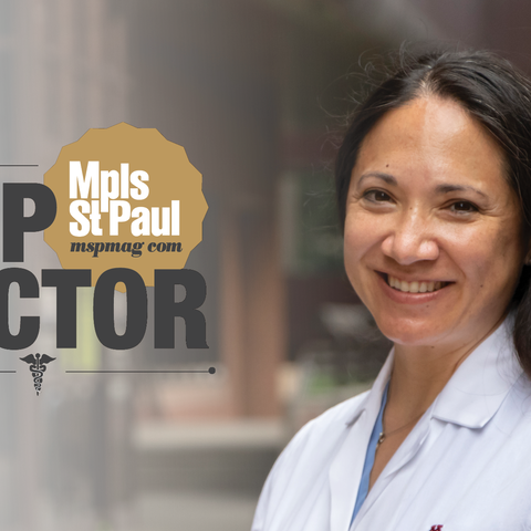 A doctor with the Top Doctors logo