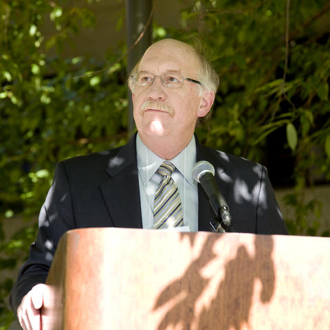 A photo of former Regional Duluth Campus Dean, Dr. Gary L. Davis giving a speech to a crowd during his time as Regional Dean. 